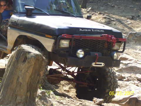 1978 Ford Bronco - A 1978 Ford Bronco navigates a rocky trail with its front end angled towards the camera.