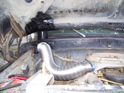 1978 Ford Bronco - Custom snorkel installation in a vehicle's engine bay.