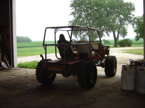 1992 Ford Bronco - This custom buggy features a prominent roll cage and oversized tires, suggesting it's built for off-road use.