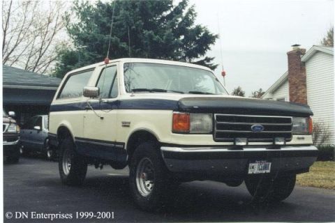 1990 Ford Bronco - This 1987 Ford Bronco is shown from a three-quarter front angle, parked outdoors.