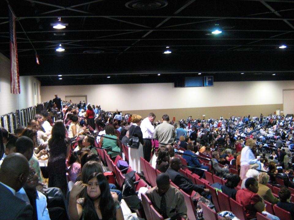 Crowd of attendees in a large indoor auditorium