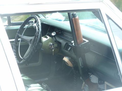 2000 Ford Crown Victoria - The interior of a 1970 Plymouth Satellite features a shotgun rack mounted to the dashboard.
