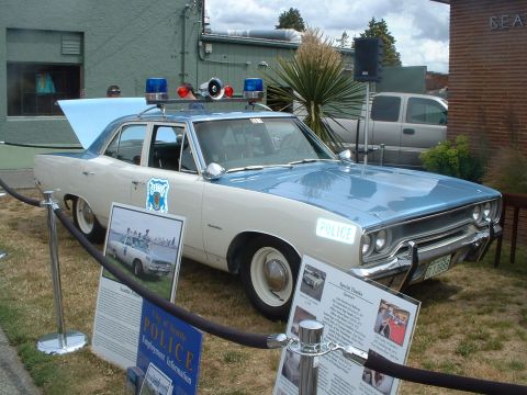 2000 Ford Crown Victoria - This two-tone blue and white 1970 Plymouth Satellite served as a Seattle Police unit, a classic light bar and siren.
