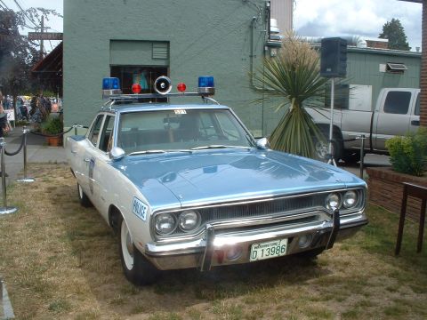 2000 Ford Crown Victoria - This 1970 Plymouth Satellite is equipped as a police vehicle with a light bar and siren.