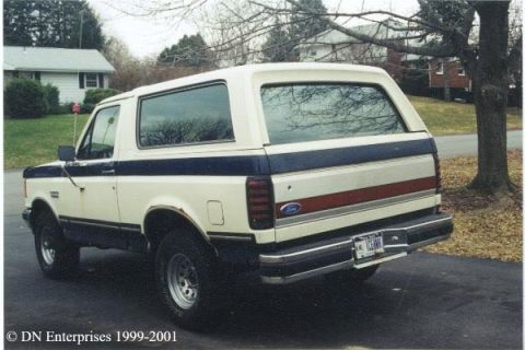 1990 Ford Bronco - This 1990 Ford Bronco is shown from a three-quarter front view, parked outdoors.