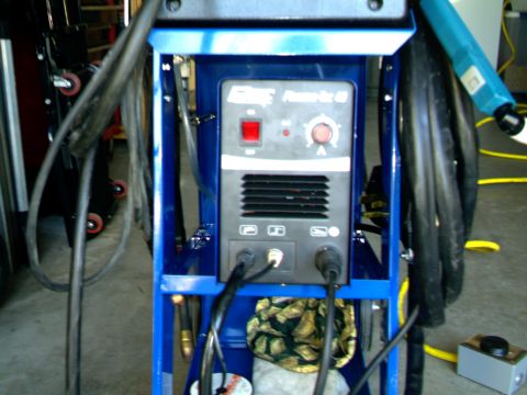 1989 Ford Bronco - A blue welding machine is shown with various cables and controls visible.