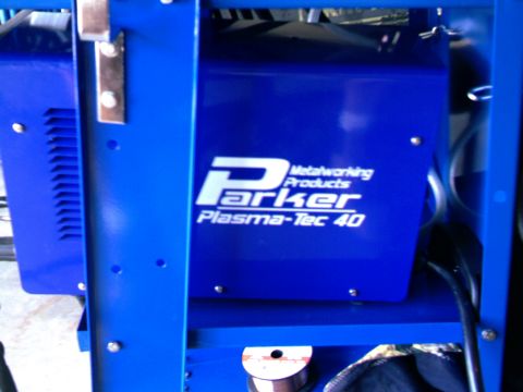 1989 Ford Bronco - Close-up of blue Parker Plasma-Tec 40 metalworking equipment with visible branding and wiring.