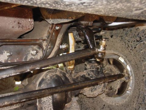 1986 Ford Bronco - Undercarriage view of the front suspension and steering components on a 1986 Ford Bronco.