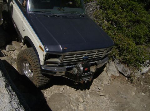 1986 Ford Bronco - This Ford Bronco navigates a rocky trail, its off-road capabilities.
