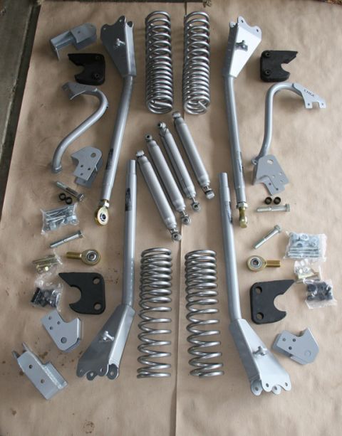 1993 Ford Bronco - Various suspension components, including springs and shocks, are arranged for display.