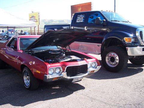 1972 Ford Ranchero - A 1972 Ford Ranchero and a large Ford F-650 truck are parked side-by-side at an outdoor event.