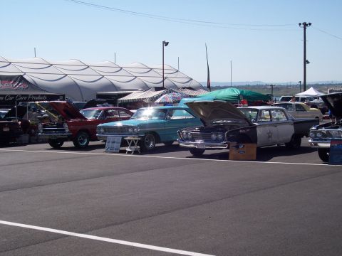 1972 Ford Ranchero - Classic cars are displayed at an outdoor event, with a variety of makes and models visible.
