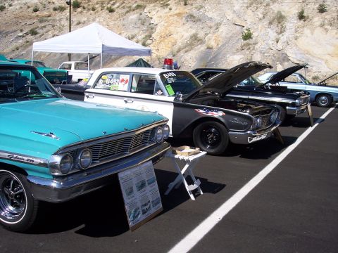 1972 Ford Ranchero - Several vintage cars are lined up at an outdoor event, with a turquoise Ford Galaxie in the foreground.