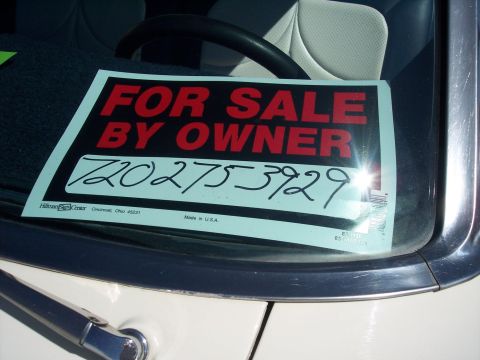 1972 Ford Ranchero - A 'For Sale By Owner' sign is displayed on the windshield of a vehicle, with a phone number written on it.