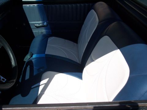 1972 Ford Ranchero - The interior features custom two-tone seats with a unique stitched pattern and blue seatbelts.