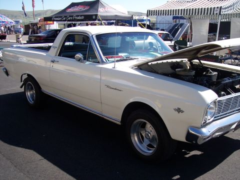 1972 Ford Ranchero - A white 1966 Ford Ranchero is parked with its hood open at an outdoor event.