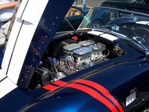 1972 Ford Ranchero - Blue Ford Cobra's V8 engine with four carburetors is visible with the hood open.