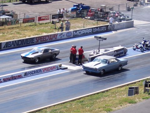 1972 Ford Ranchero - Two cars race down the drag strip at Bandimere Speedway, with a 1966 Ford Fairlane in the foreground.