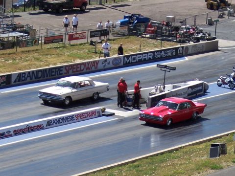 1972 Ford Ranchero - A red 1962 Ford Falcon drag car is on the track at Bandimere Speedway.