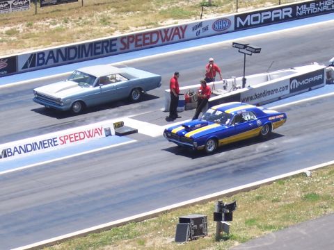 1972 Ford Ranchero - A blue and yellow 1969 Mercury Cougar drag car is lined up at Bandimere Speedway.