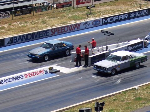 1972 Ford Ranchero - Two cars prepare for a drag race at Bandimere Speedway, with one appearing to be a 1967 Dodge Coronet.