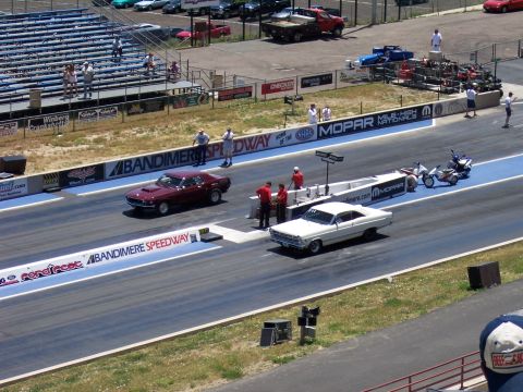 1972 Ford Ranchero - Two classic American muscle cars compete on a drag strip at Bandimere Speedway.