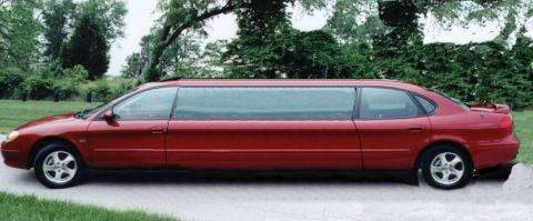 1991 Ford Taurus - This red 1991 Ford Taurus has been converted into a limousine, its extended length from a side profile.
