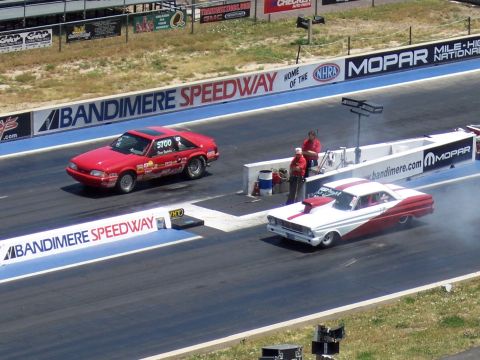 1972 Ford Ranchero - Two drag cars compete on Bandimere Speedway, one red and one red and white.