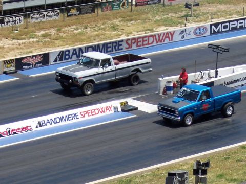 1972 Ford Ranchero - Two pickup trucks compete on the drag strip at Bandimere Speedway.