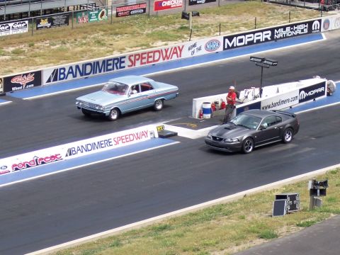 1972 Ford Ranchero - Two cars prepare for a race on the drag strip at Bandimere Speedway, with a classic Ford Falcon and a modern Ford Mustang.