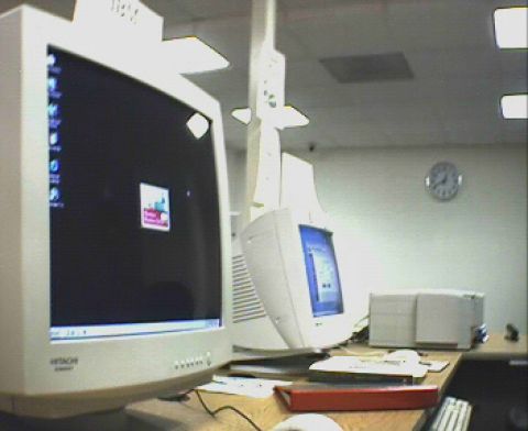 1991 Ford Taurus - This office scene features multiple computer monitors and office equipment, not a 1991 Ford Taurus.