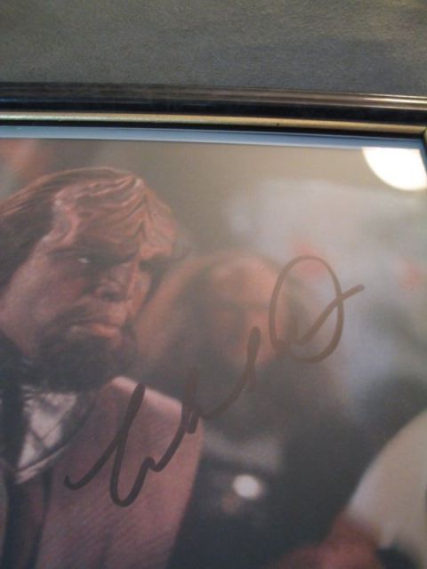 1998 Ford Crown Victoria - This is an autographed photo of a man with a beard, a signature across the image.