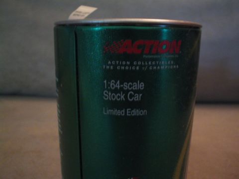 1998 Ford Crown Victoria - This is a green tin can, likely packaging for a collectible stock car, text about Action Collectibles.