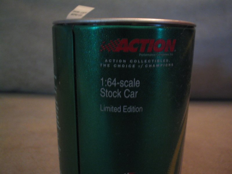Green tin can with 'Action Collectibles' and '1:64-scale Stock Car Limited Edition' text