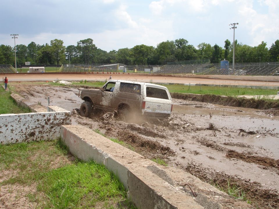 1989 Ford Bronco in mud bog, rear view