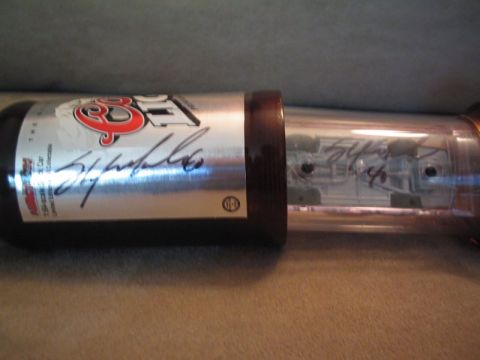 1998 Ford Crown Victoria - Signed Coors Light beer can displayed in a protective tube.