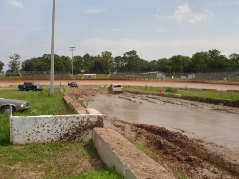 1989 Ford Bronco - Vehicles navigate a muddy track at Putnam Speedway during an event on June 24, 2007.