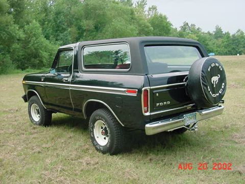 1979 Ford Bronco - This 1979 Ford Bronco is shown in a rear three-quarter view, its iconic spare tire mounted on the tailgate.
