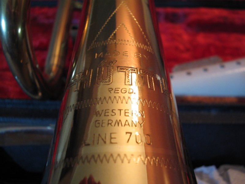 Engraved trumpet bell showing "MADE BY SCHUTT", "RECD. WESTERN GERMANY", and "LINE 700"