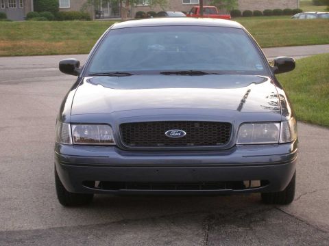 1998 Ford Crown Victoria - Front view of a 1998 Ford Crown Victoria, showing its grille and headlights.