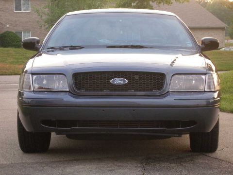 1998 Ford Crown Victoria - The front grille and headlight design suggest this Ford Crown Victoria is from the 2003-2011 model years.