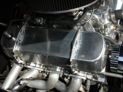 1998 Ford Crown Victoria - Close-up view of a highly polished engine component with visible exhaust piping.