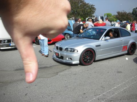 1998 Ford Crown Victoria - Silver BMW M3 coupe with red accents at a car meet.