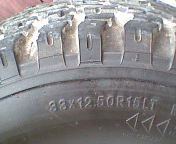 1989 Ford Bronco - Tire detail showing size information and a website watermark.