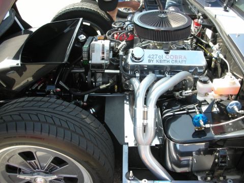 1998 Ford Crown Victoria - Close-up view of a custom engine bay, highlighting the "427ci COBRA BY KEITH CRAFT" valve cover and exhaust headers.