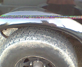 1989 Ford Bronco - A close-up view shows the tire and fender of a vehicle, with a watermark from Supermotors.net.