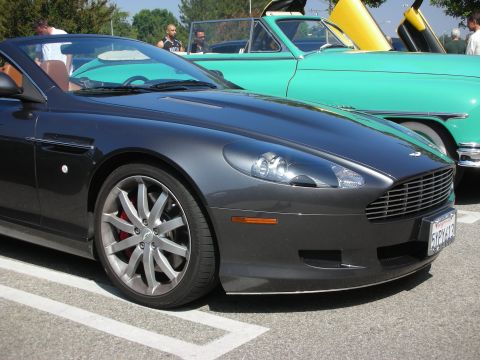 1998 Ford Crown Victoria - Aston Martin DB9 convertible and a classic teal car at a meet.