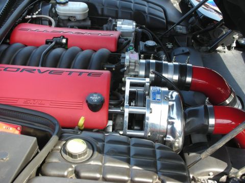 1998 Ford Crown Victoria - Close-up of a supercharged Corvette engine, likely from the C5 generation.