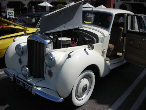 1998 Ford Crown Victoria - A classic Bentley S1 from the mid-1950s is displayed with its engine compartment open.