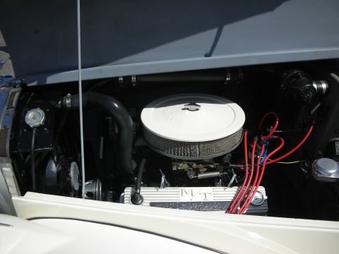 1998 Ford Crown Victoria - Close-up view of a car's engine bay, showing the air filter and spark plug wires.